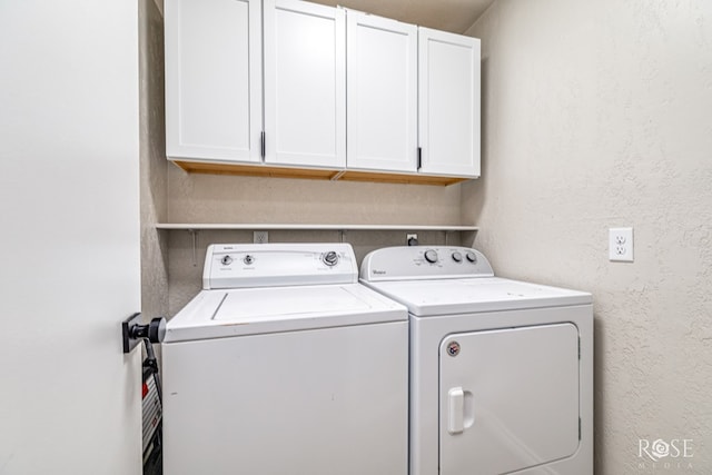 3610 Southland Blvd, San Angelo, TX 76904 - laundry room featuring cabinet space, washer and dryer, and a textured wall