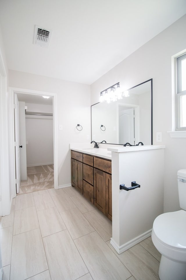 bathroom with vanity and toilet