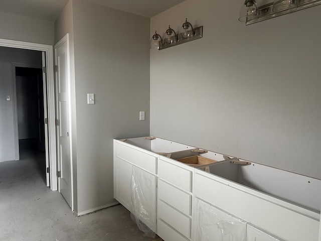 bathroom with concrete flooring