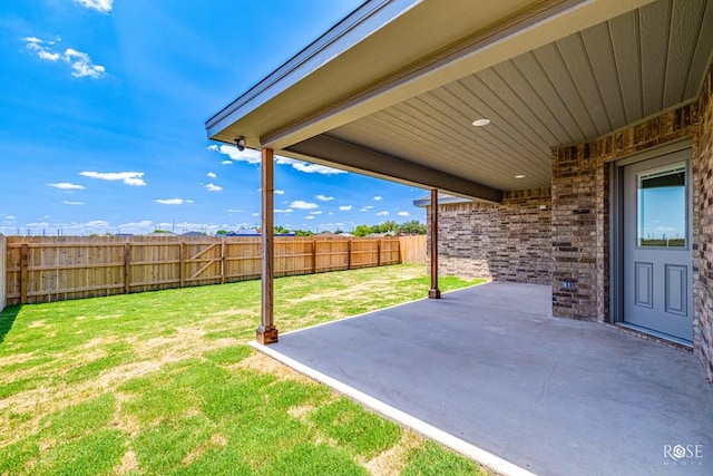 view of yard with a fenced backyard and a patio