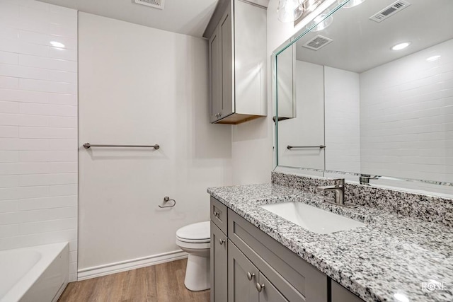 full bath with toilet, visible vents, and wood finished floors