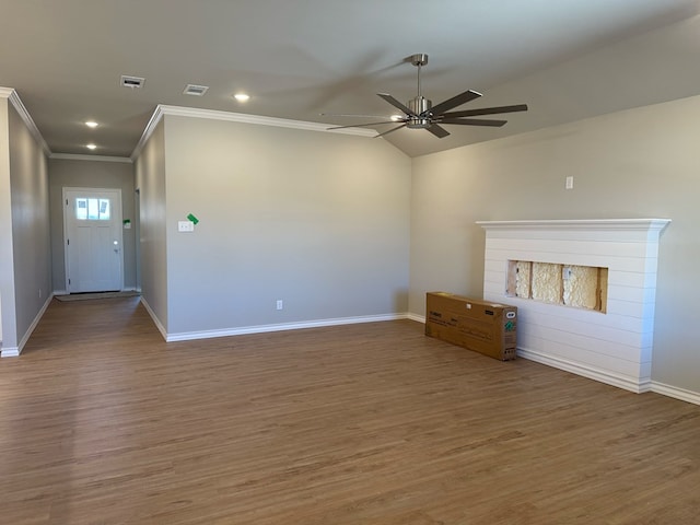 unfurnished living room with a ceiling fan, baseboards, visible vents, and wood finished floors