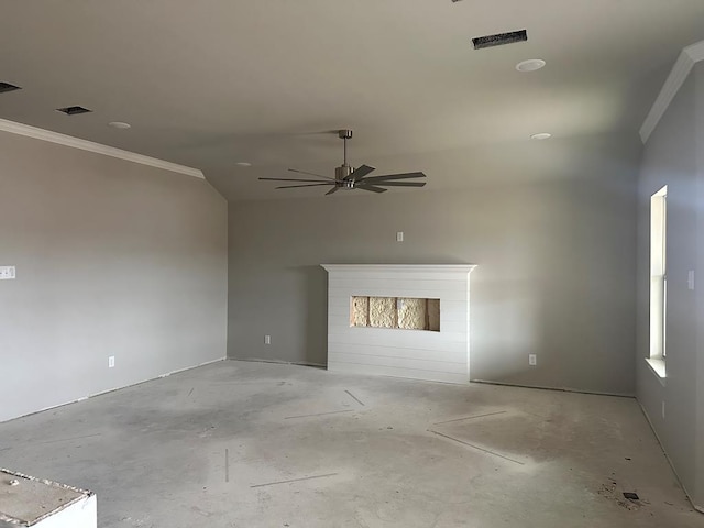 unfurnished living room with ceiling fan, crown molding, and a fireplace