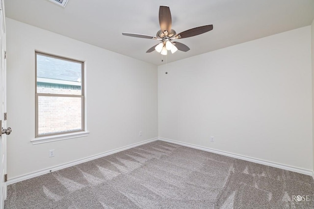 empty room featuring carpet floors and ceiling fan