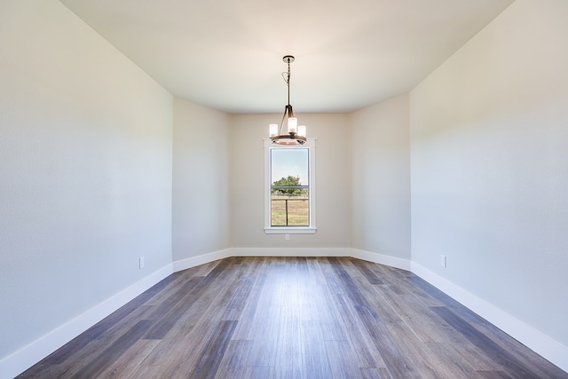 5001 Fm 2333, Bronte, TX 76933 - spare room with a chandelier, dark wood-style flooring, and baseboards