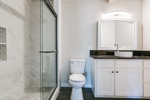 5001 Fm 2333, Bronte, TX 76933 - full bath featuring toilet, a shower stall, vanity, wood finished floors, and baseboards