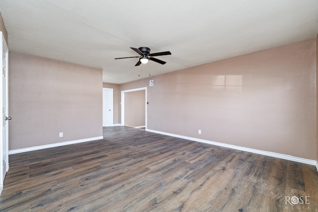 spare room with a textured ceiling, dark hardwood / wood-style floors, and ceiling fan