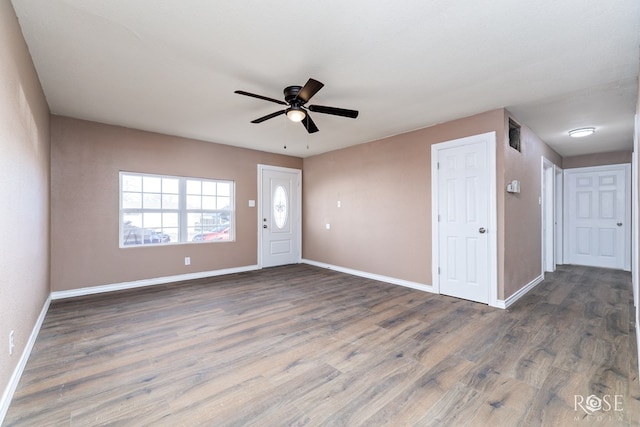 interior space featuring dark hardwood / wood-style floors and ceiling fan