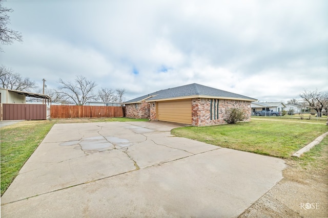 view of side of property with a yard and a patio