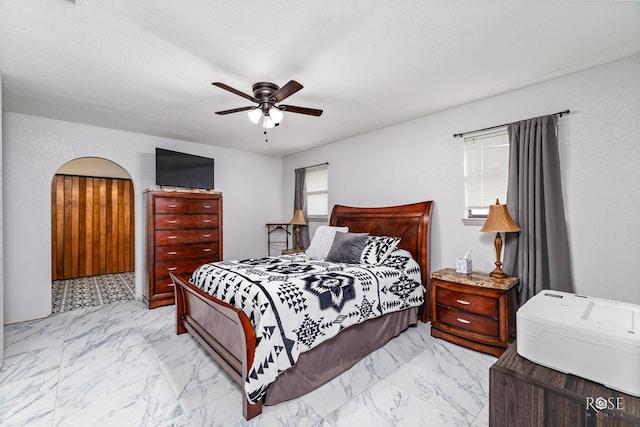 bedroom with a textured ceiling and ceiling fan