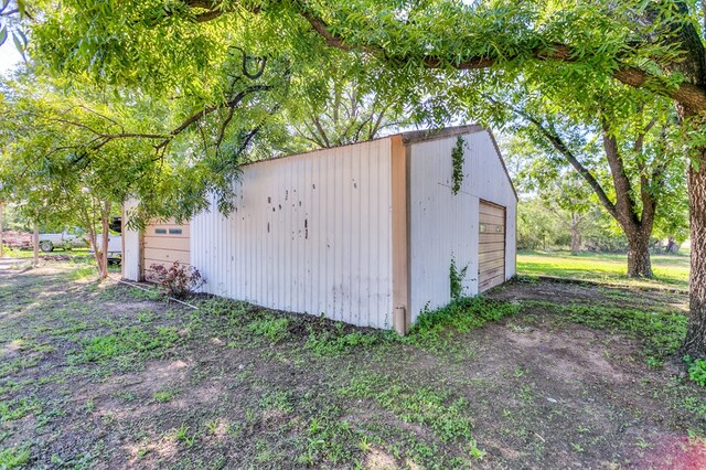 view of outbuilding featuring a garage