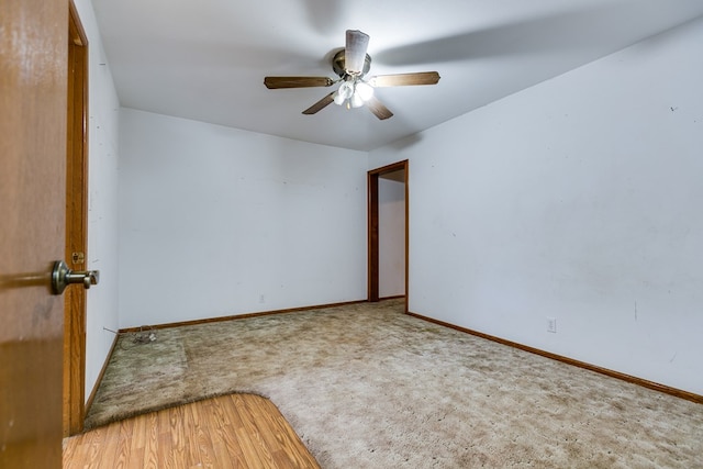 spare room with hardwood / wood-style floors and ceiling fan