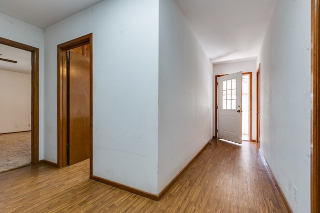 hall with light hardwood / wood-style floors