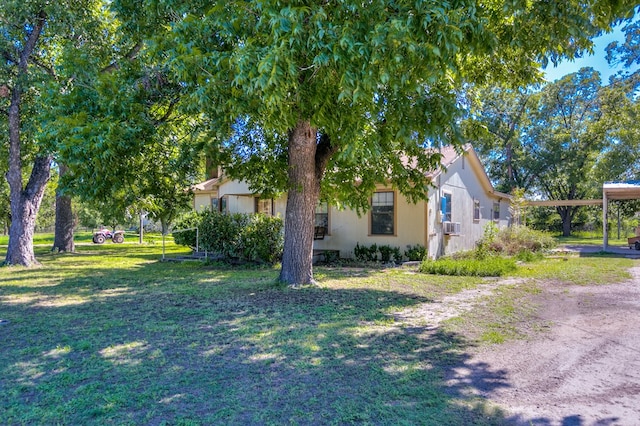 view of home's exterior with a yard