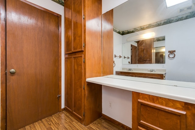 bathroom featuring vanity and hardwood / wood-style flooring