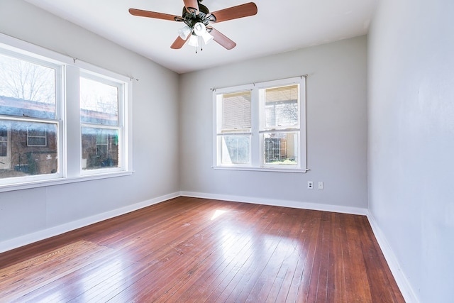 unfurnished room with ceiling fan, baseboards, and hardwood / wood-style floors