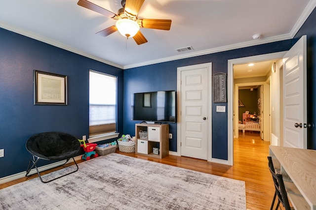 sitting room featuring ornamental molding, ceiling fan, and light hardwood / wood-style floors