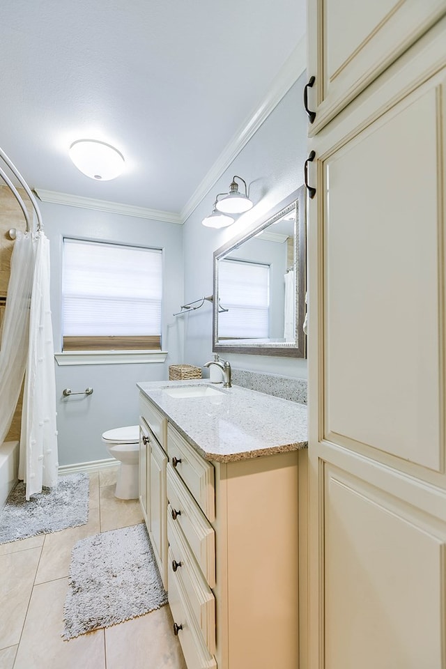 full bathroom featuring ornamental molding, vanity, toilet, tile patterned floors, and shower / bath combo with shower curtain