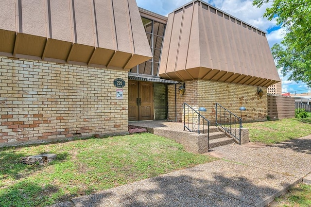 220-K W Twohig Ave, San Angelo, TX 76901 - doorway to property with brick siding