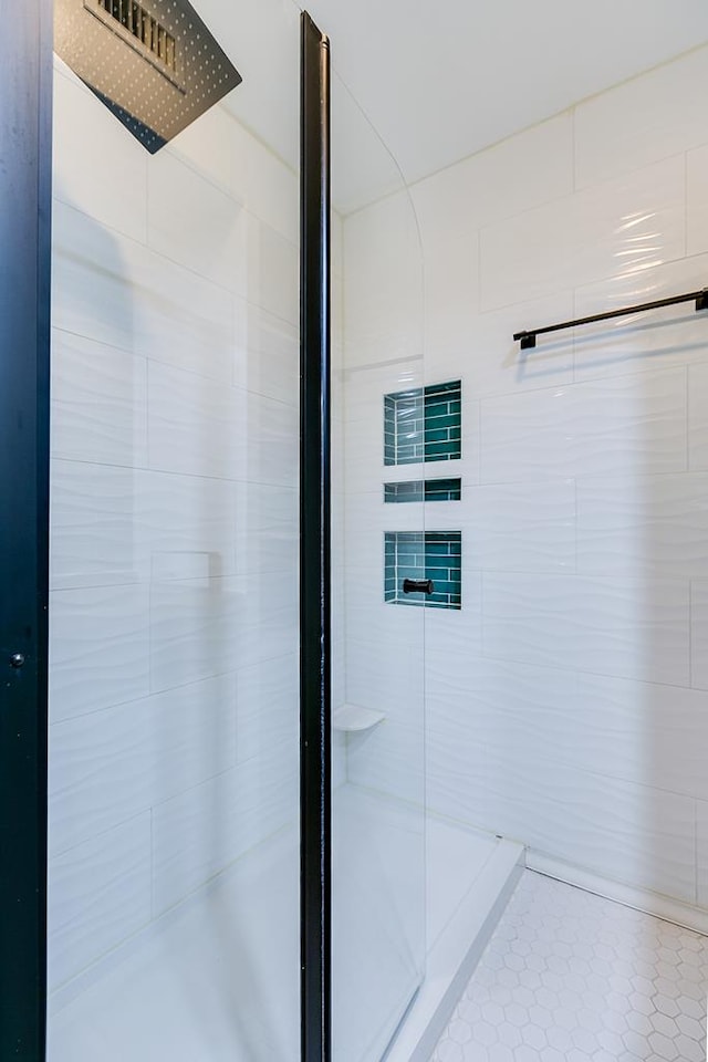 220-K W Twohig Ave, San Angelo, TX 76901 - bathroom with a shower stall, tile walls, and tile patterned flooring