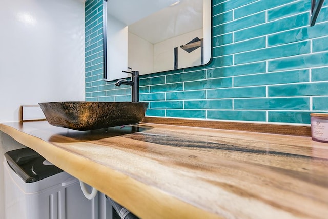 220-K W Twohig Ave, San Angelo, TX 76901 - bathroom featuring a sink and decorative backsplash