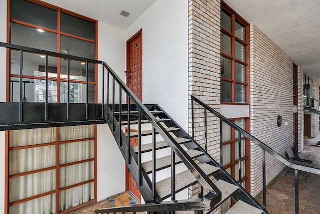 220-K W Twohig Ave, San Angelo, TX 76901 - stairs with stone finish flooring and a textured ceiling