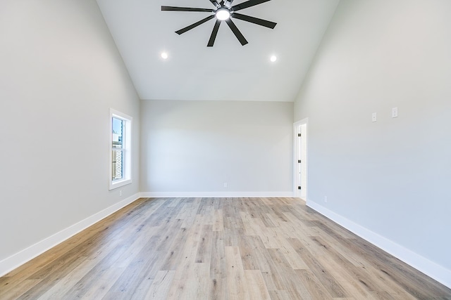 unfurnished room with ceiling fan, high vaulted ceiling, and light hardwood / wood-style flooring