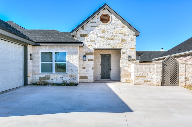 view of front of property with a garage