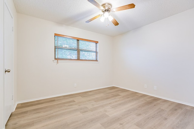 1809 N Harrison St, San Angelo, TX 76901 - unfurnished room featuring ceiling fan, a textured ceiling, baseboards, and light wood-type flooring