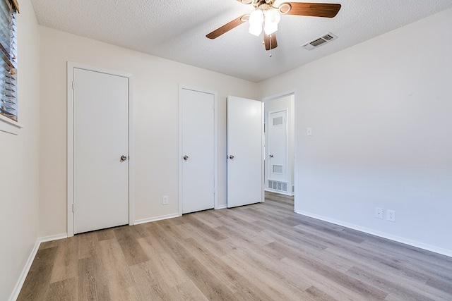 1809 N Harrison St, San Angelo, TX 76901 - unfurnished bedroom with visible vents, wood finished floors, and baseboards