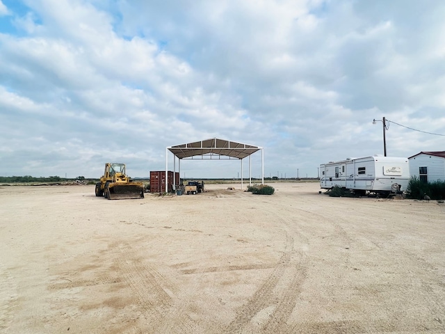 view of vehicle parking with a carport