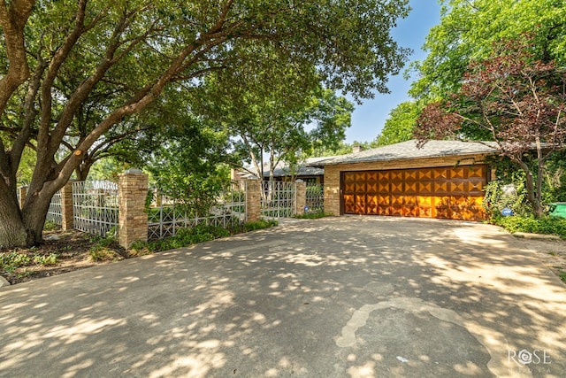 1703 Christoval Rd, San Angelo, TX 76903 - exterior space featuring driveway and an attached garage