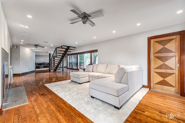 1703 Christoval Rd, San Angelo, TX 76903 - living area featuring ceiling fan, stairway, wood finished floors, and recessed lighting