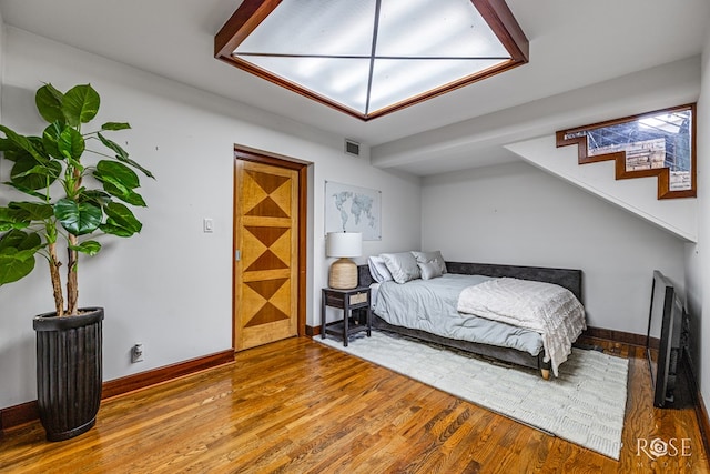 1703 Christoval Rd, San Angelo, TX 76903 - bedroom with wood finished floors and baseboards