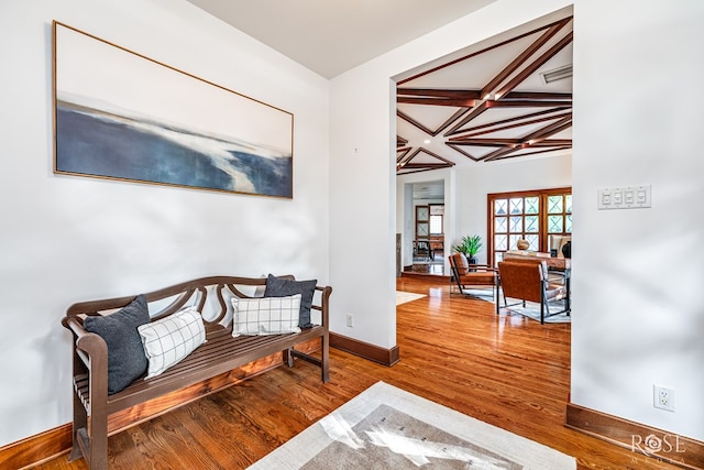 1703 Christoval Rd, San Angelo, TX 76903 - living area featuring coffered ceiling, wood finished floors, baseboards, and beamed ceiling