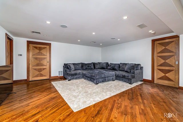 1703 Christoval Rd, San Angelo, TX 76903 - living room with dark wood-type flooring, recessed lighting, and baseboards