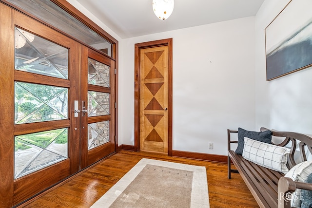 1703 Christoval Rd, San Angelo, TX 76903 - entryway featuring baseboards, dark wood-style floors, and french doors