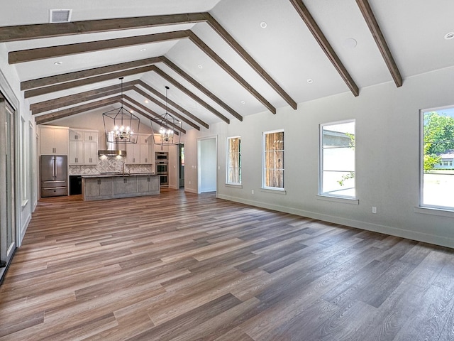 1603 Paseo De Vaca St, San Angelo, TX 76901 - unfurnished living room featuring a chandelier, wood finished floors, and recessed lighting