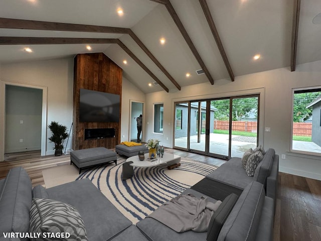1603 Paseo De Vaca St, San Angelo, TX 76901 - living area with wood finished floors, beamed ceiling, recessed lighting, a fireplace, and high vaulted ceiling