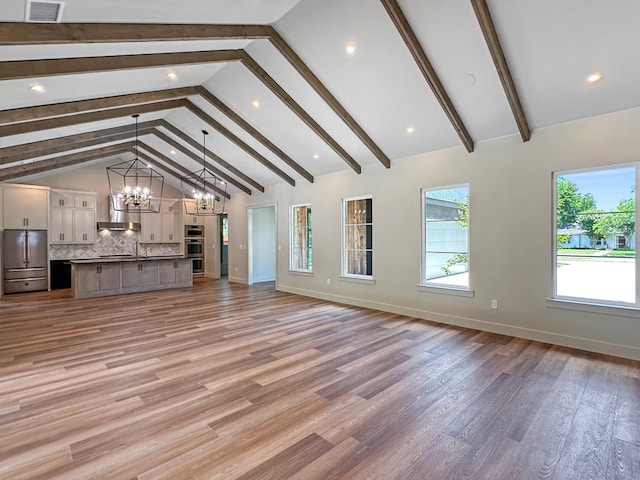 1603 Paseo De Vaca St, San Angelo, TX 76901 - unfurnished living room with a chandelier, light wood-style flooring, and recessed lighting