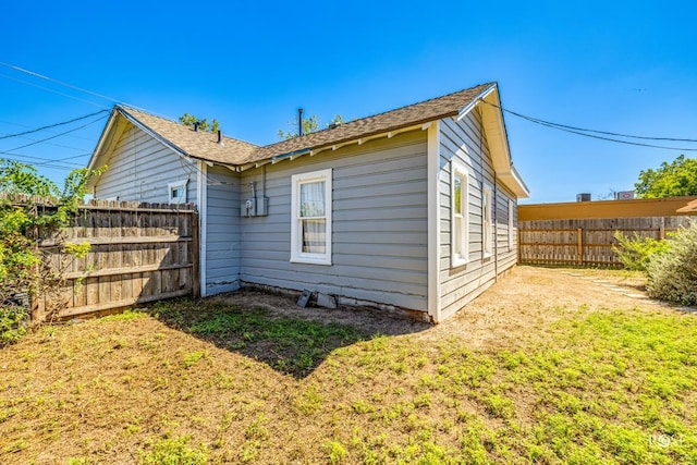 view of home's exterior featuring a lawn and a fenced backyard