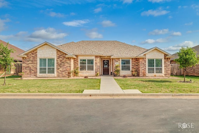 5033 Scarlet Oak Ln, San Angelo, TX 76904 - view of front of home featuring a shingled roof and brick siding