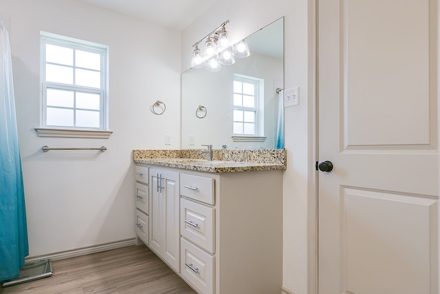 1501 Montague Ave, San Angelo, TX 76905 - bathroom with vanity and wood finished floors