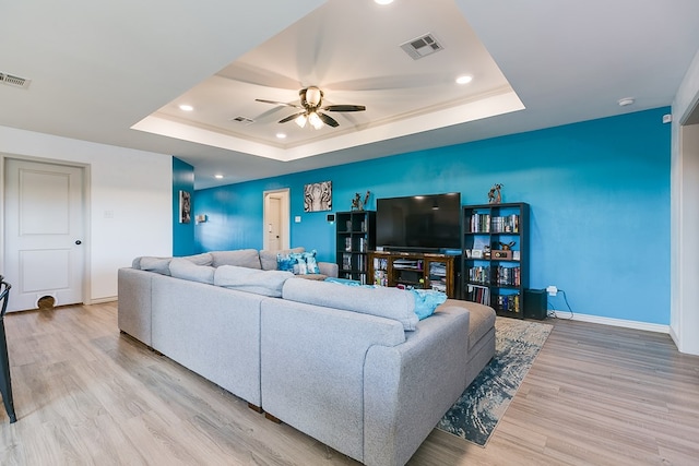 1501 Montague Ave, San Angelo, TX 76905 - living room with a raised ceiling, wood finished floors, a ceiling fan, and recessed lighting