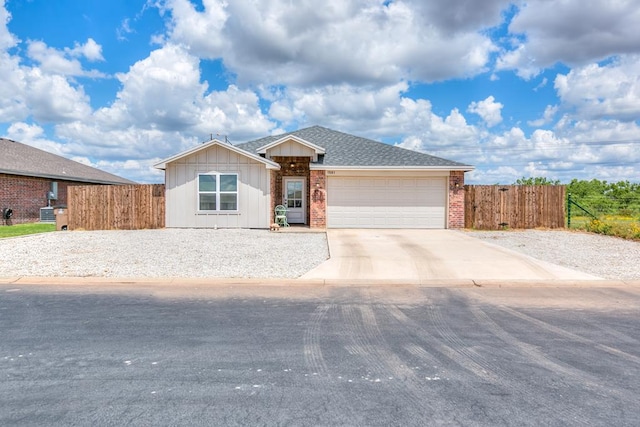 1501 Montague Ave, San Angelo, TX 76905 - ranch-style home with concrete driveway, a garage, and brick siding