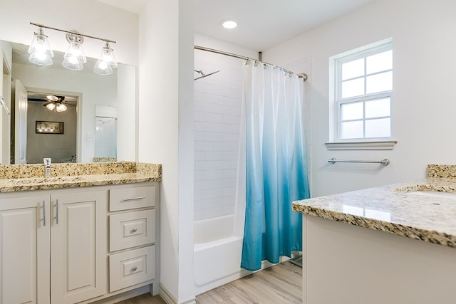 1501 Montague Ave, San Angelo, TX 76905 - full bath featuring vanity, shower / bath combo, wood finished floors, and ceiling fan