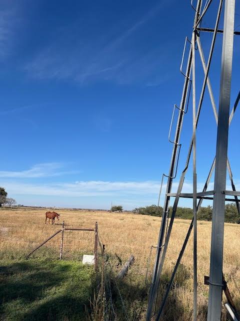 view of yard with a rural view