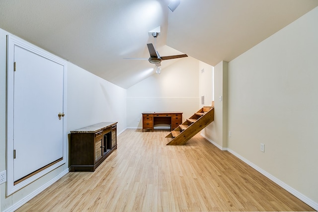 additional living space featuring ceiling fan, vaulted ceiling, and light wood-type flooring