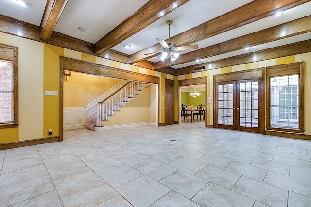 basement featuring french doors and ceiling fan