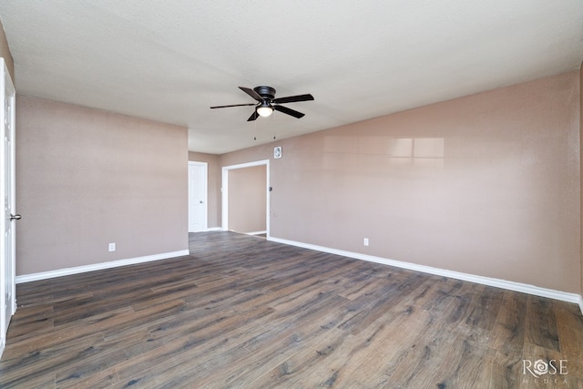 1611 Mission Ave, San Angelo, TX 76905 - empty room with ceiling fan, baseboards, and dark wood-type flooring
